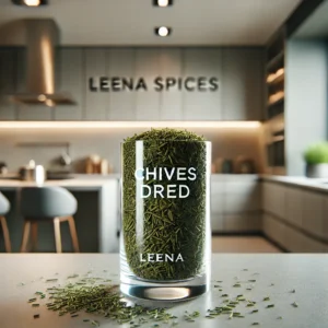 Vibrant green dried chives displayed in a clear jar on a clean wooden kitchen counter.