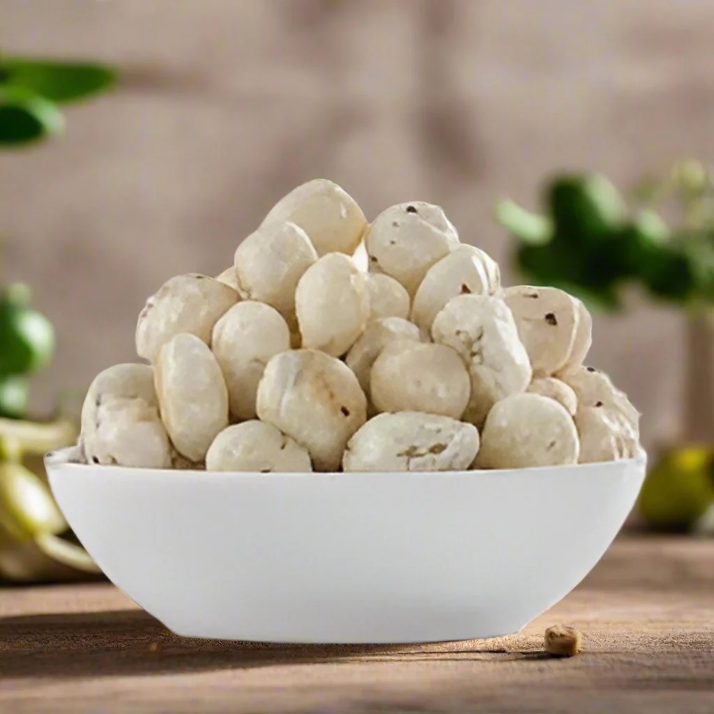 A rustic ceramic bowl filled with golden, crispy roasted makhana fox nuts lightly dusted with savory Indian spices, set on a warm kitchen countertop.